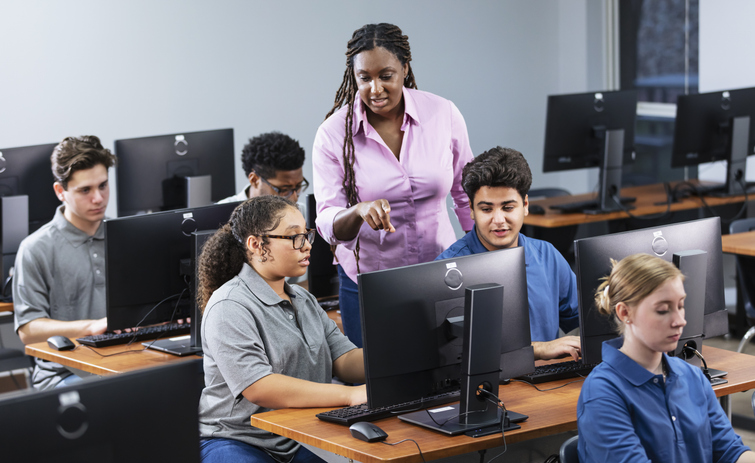 High school students and teacher in computer lab